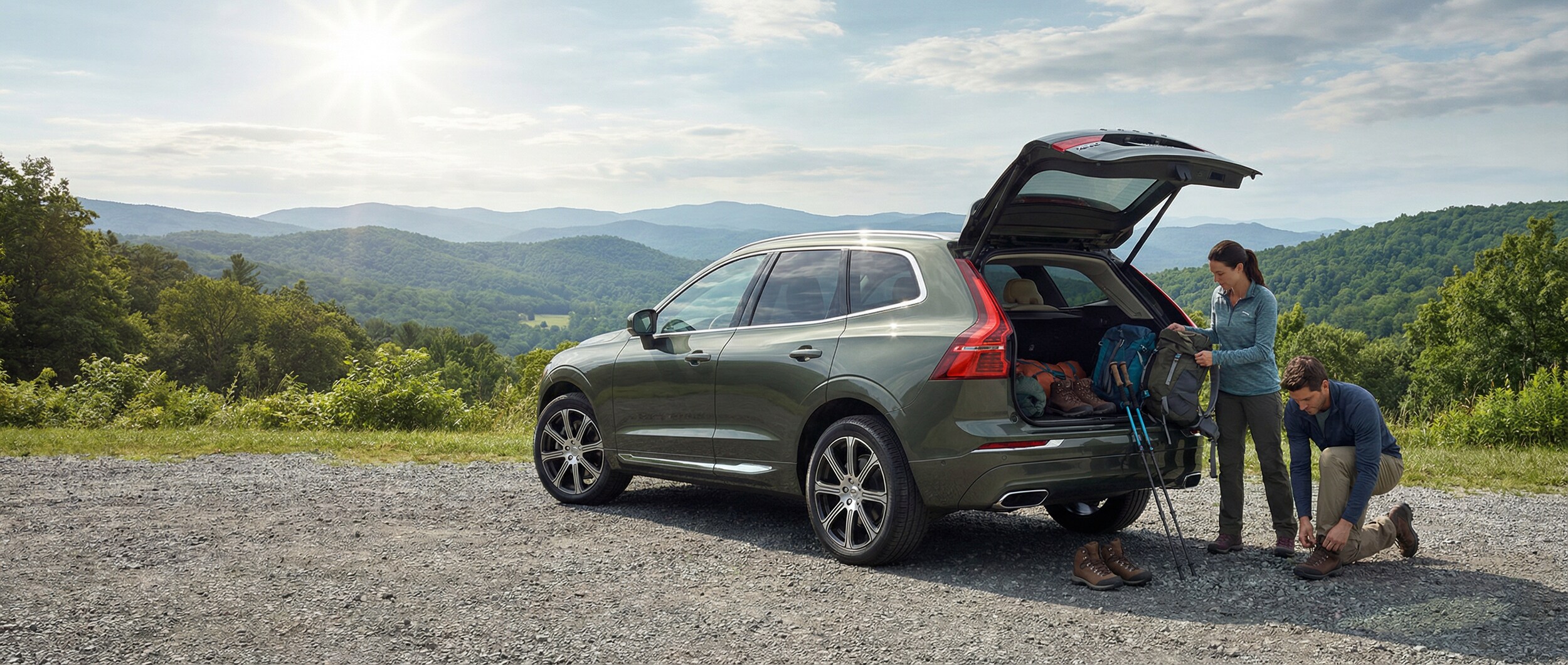 Volvo XC60 at hiking trail parking area in Greenville, SC with mountain views
