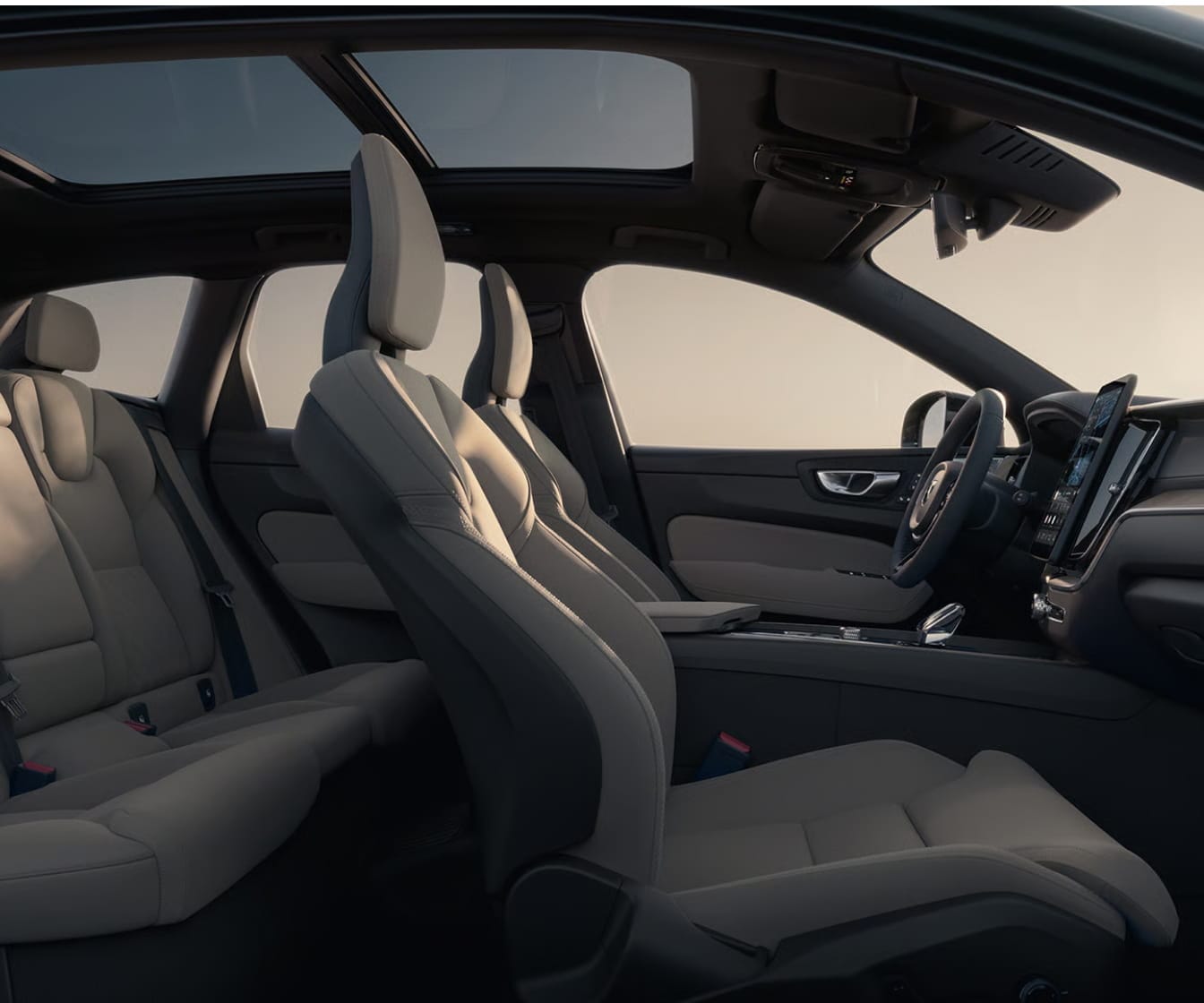 Light-colored Volvo XC60 interior with panoramic sunroof and premium seating.