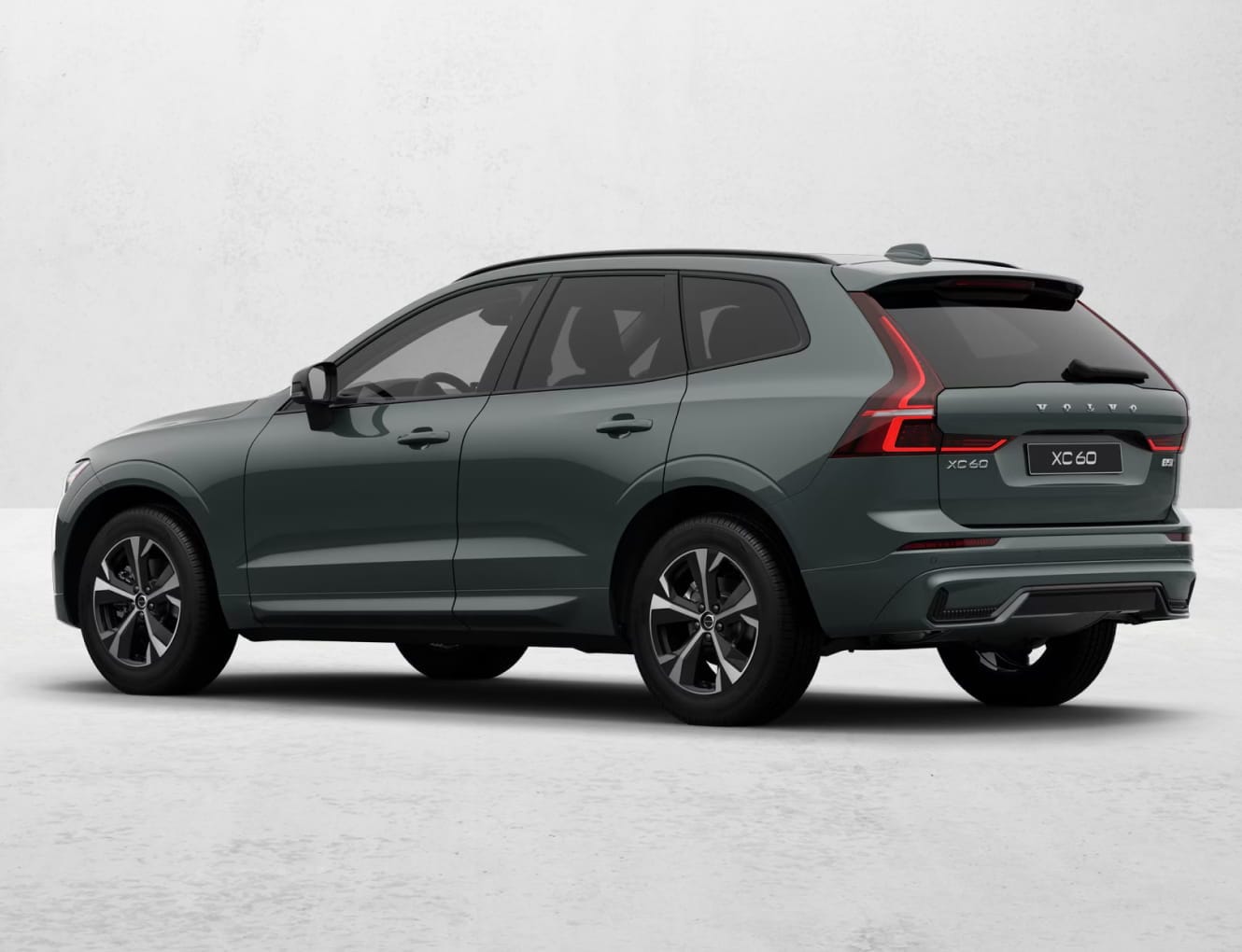 Semi-dark green Volvo XC60 shown from a rear three-quarter view.