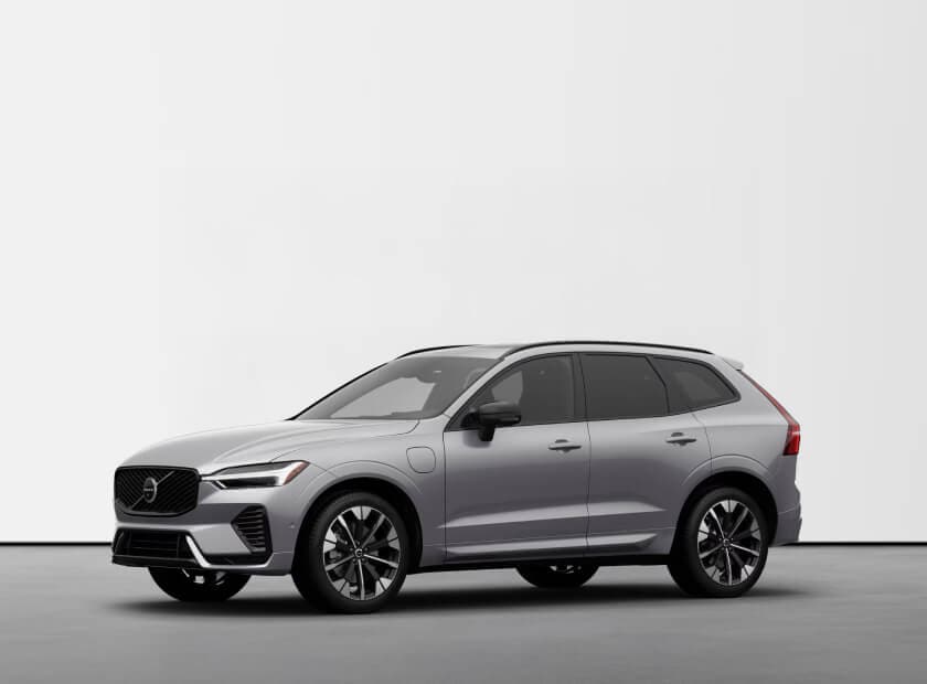 2026 Volvo XC60 Ultra Plug-in Hybrid in Aurora Silver, front three-quarter view in an studio environment.