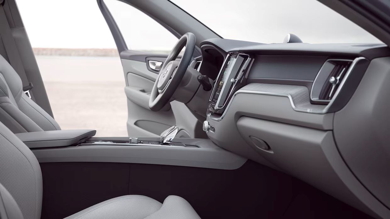 All leather seats interior of a Volvo XC60, not showing the panoramic sunroof, wireless smartphone charging, and head up display.