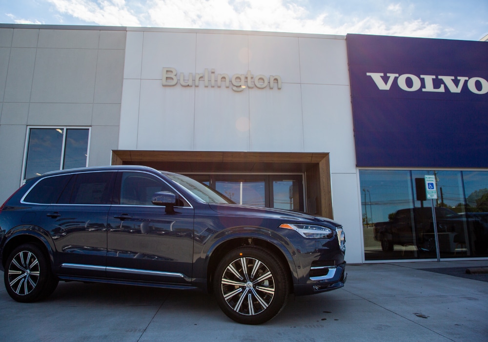 Volvo SUV parked in front of the Volvo Cars Burlington storefront