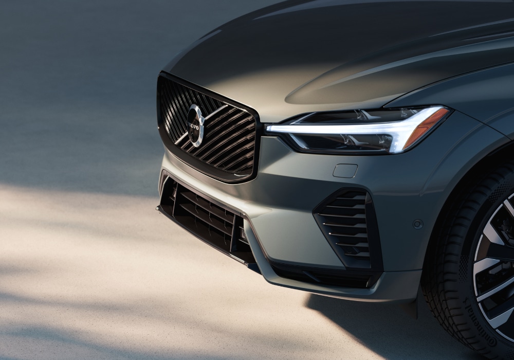 Front grille of the 2025 Volvo XC60 PHEV. The Volvo logo is visible on the front of the car