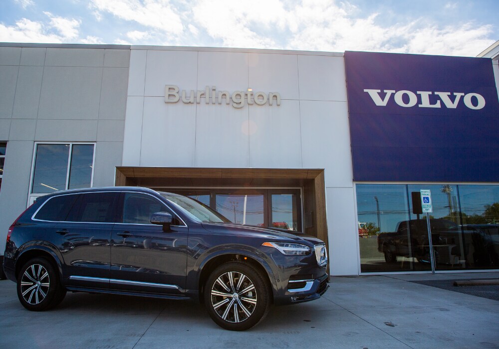 Volvo SUV parked in front of the Volvo Cars Burlington dealership