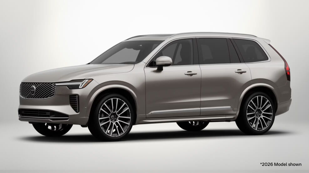 2026 Volvo XC90 Ultra in Bright Dusk, front three-quarter view with a light gray studio background.