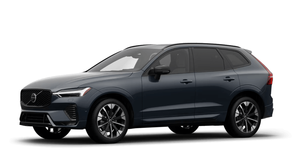 Front three-quarter view of a Volvo XC60 in Denim Blue on a white background.