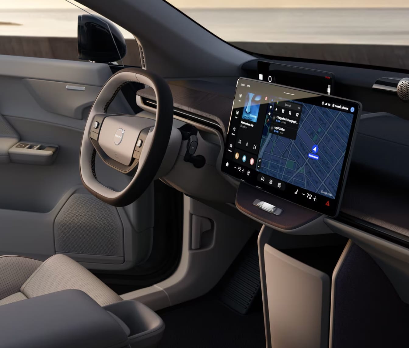 2026 EX60 interior with sleek design, featuring a steering wheel and a large touchscreen displaying a map and media controls, evoking luxury and technology.