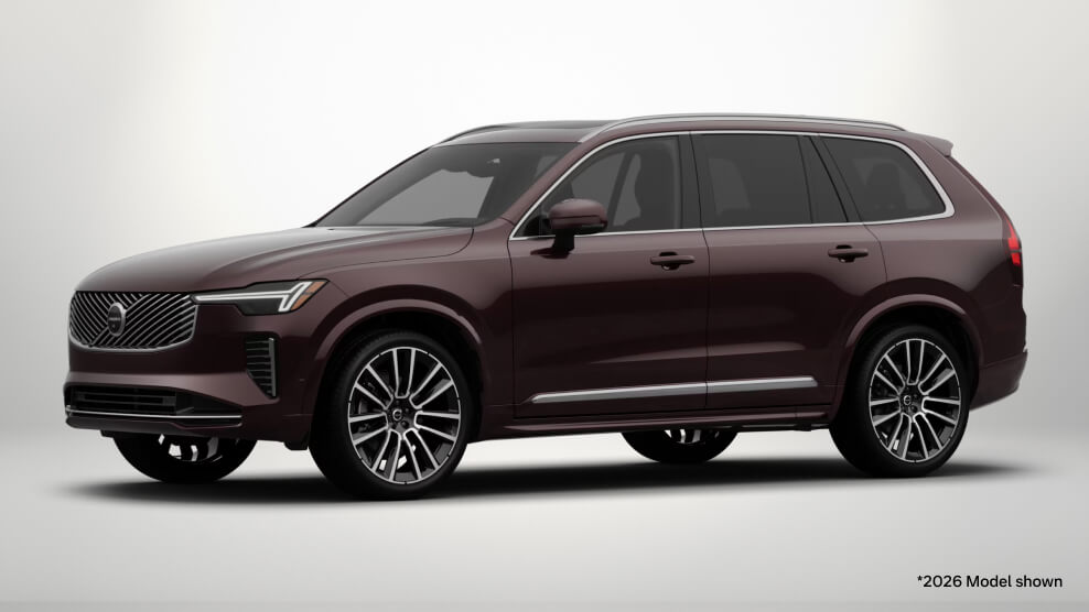 2026 Volvo XC90 Ultra in Mulberry Red, front three-quarter view with a light gray studio background.