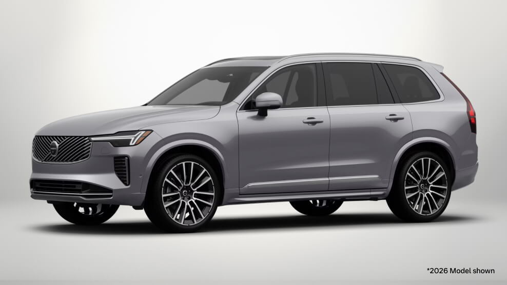 2026 Volvo XC90 Ultra in Aurora Silver, front three-quarter view with a light gray studio background.