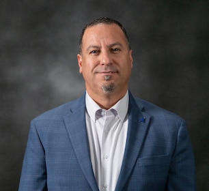 Staff member Sam Hilou from ID_0c726bfb301c