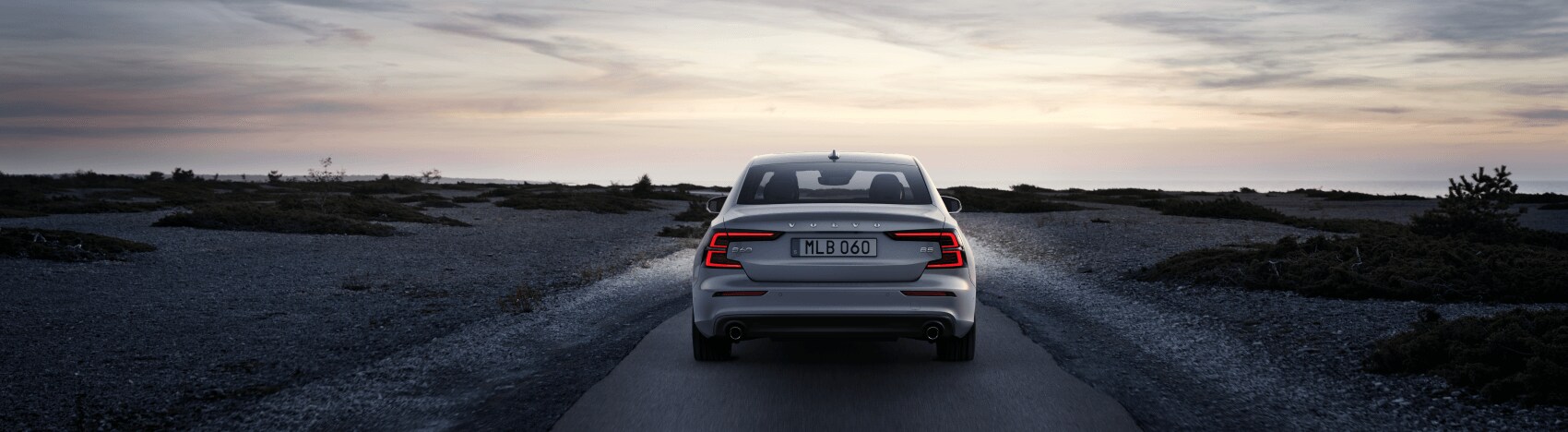 New Volvo S60 Driving on a Dirt Road