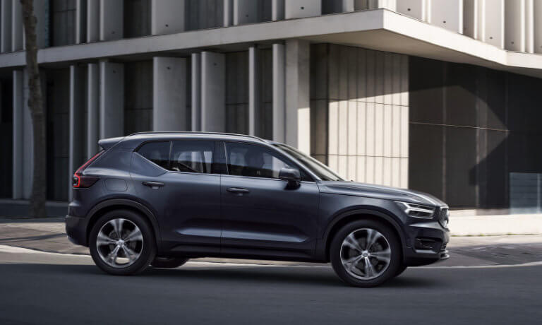2021 Volvo XC40 driving by a building