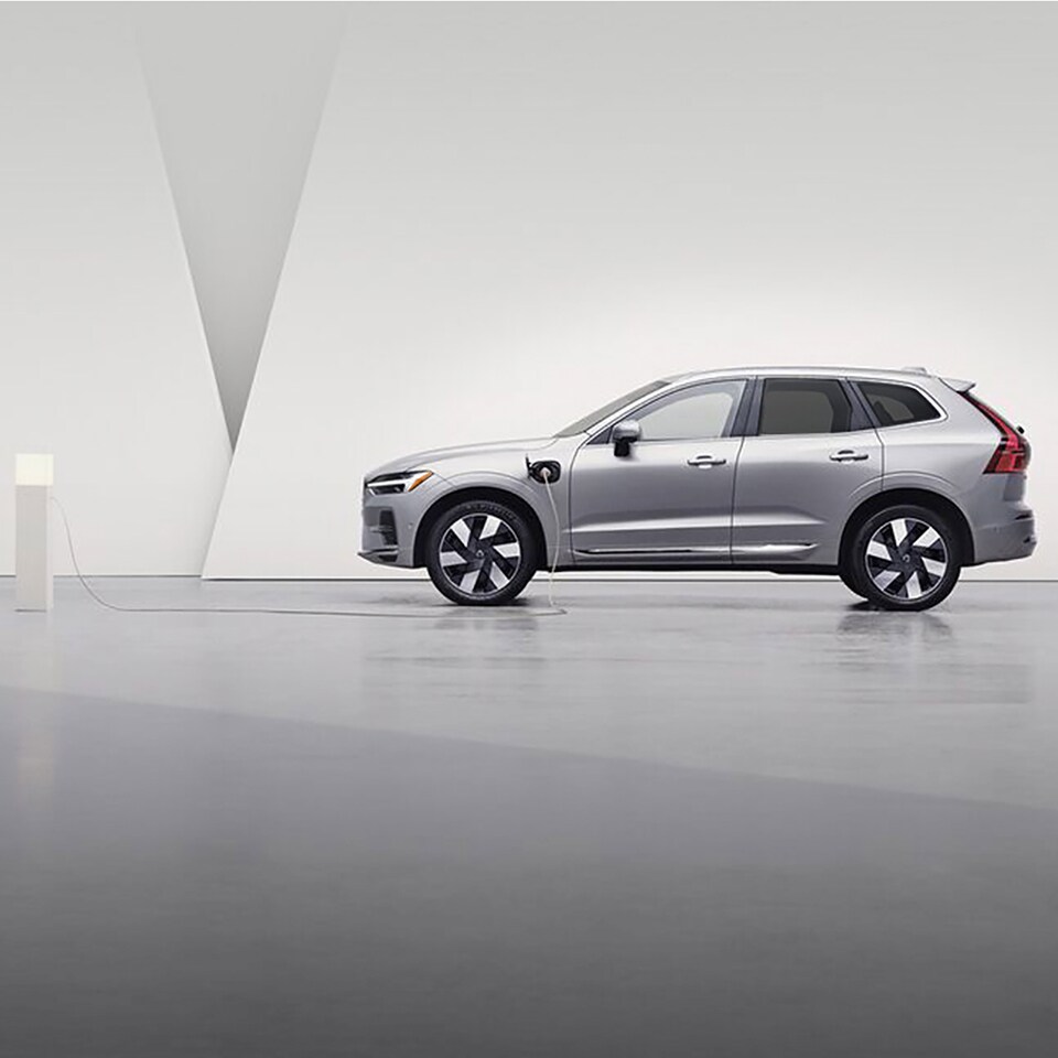 2024 Volvo XC60 Plug-In Hybrid being charged with EV charger