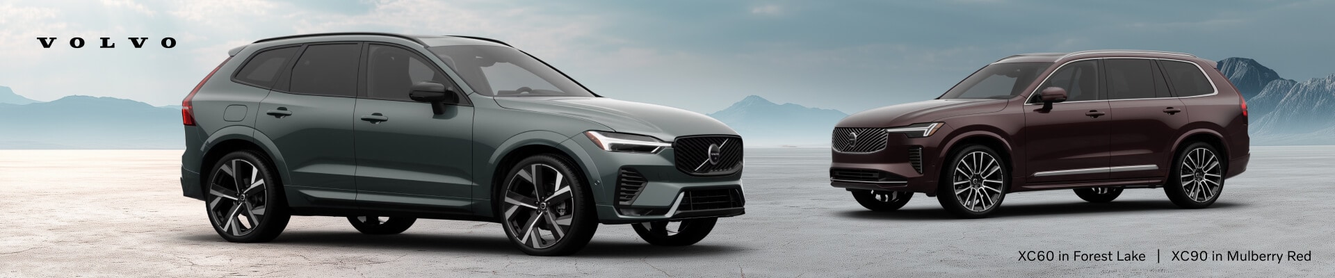 2026 Volvo XC60 Ultra in Forest Lake and XC90 Ultra in Mulberry Red, front three-quarter views on a scenic mountain plain.