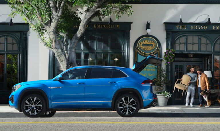 2024 Volkswagen Atlas Cross Sport exterior parked in front of shop