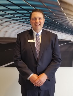 Staff member Aaron Kerstanski from 5c98b5b99998