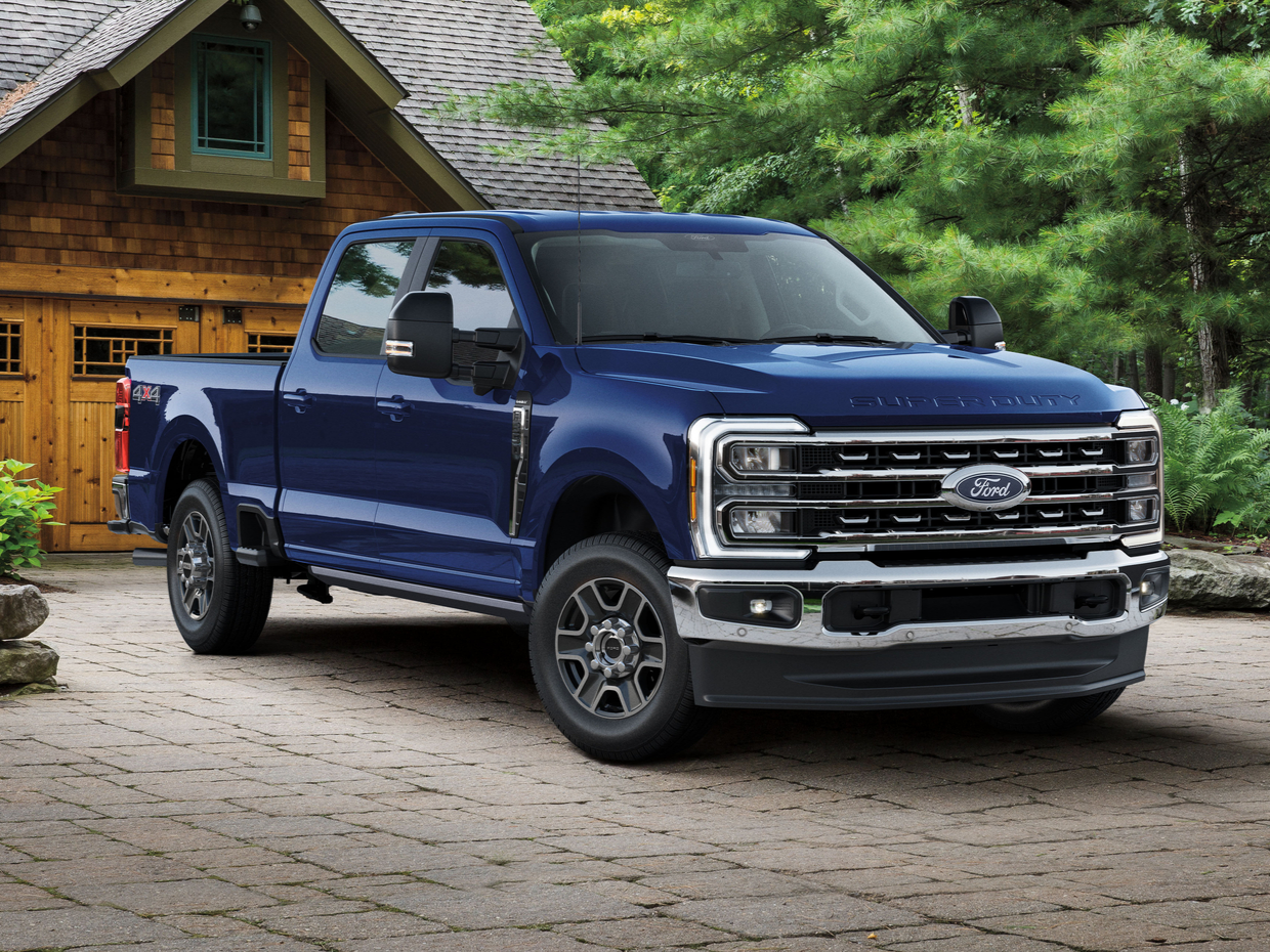 Blue 2027 Ford F-350 parked outside a house
