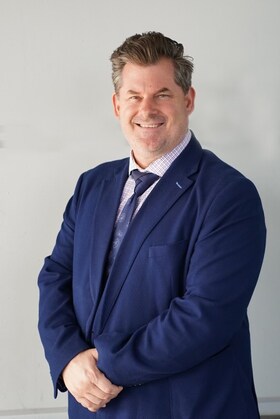 Staff member Justin Skoll from a1f009449650