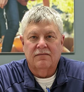 Staff member Greg Christine from ID_210472