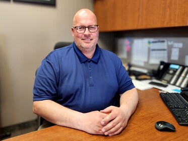 Staff member Jason Connor from ID_de0c54ee61aa