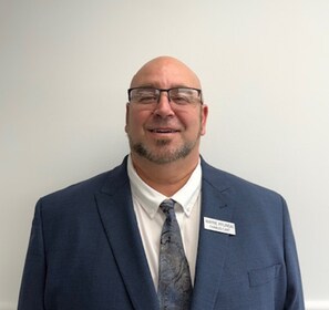 Staff member Chuck Cart from ID_ab5615402025