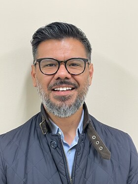 Staff member Aldo Garcia from 86fd00e59103