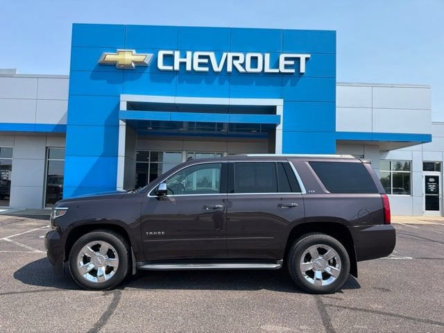 Used 2015 Chevrolet Tahoe LTZ with VIN 1GNSKCKC7FR112480 for sale in New Ulm, Minnesota