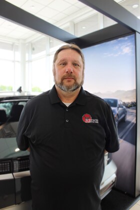 Staff member Mike Allawhat from ID_ec6d04c43e61
