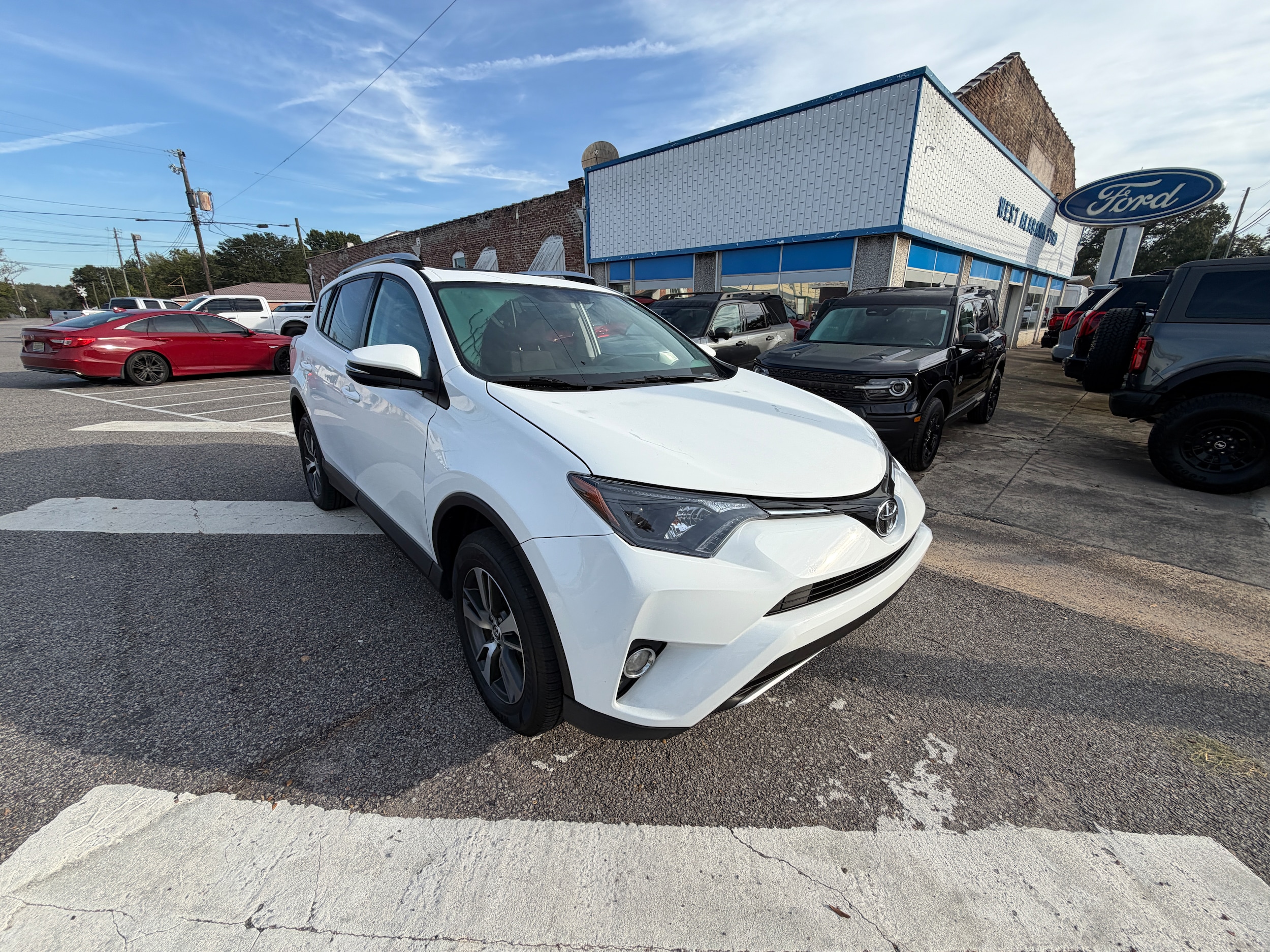 Used 2016 Toyota RAV4 XLE with VIN 2T3WFREV9GW243037 for sale in Sulligent, AL
