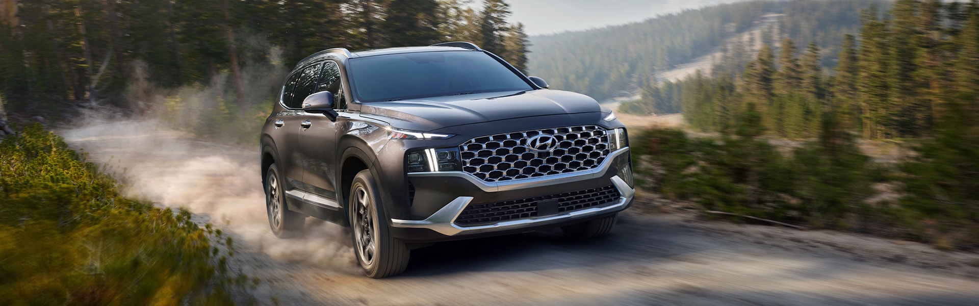 All-New 2022 Santa Fe Plug-in Hybrid at West Broad Hyundai | Dark Silver 2022 Hyundai Santa Fe PHEV Driving Fast Down Dirt Road