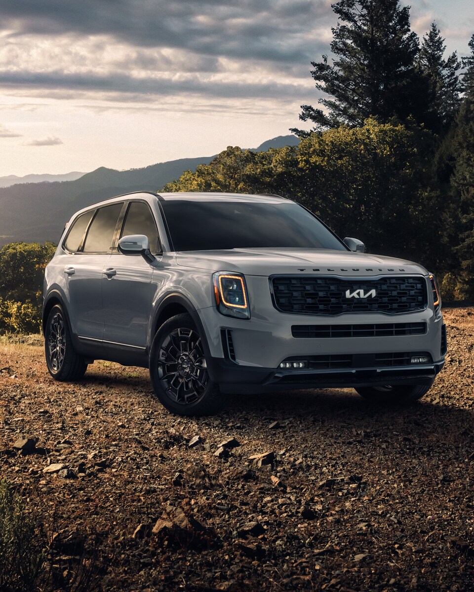 What is a Tire Rotation? at West Broad Kia | Hero Shot of the 2022 Kia Telluride Parked in a Forest Clearing