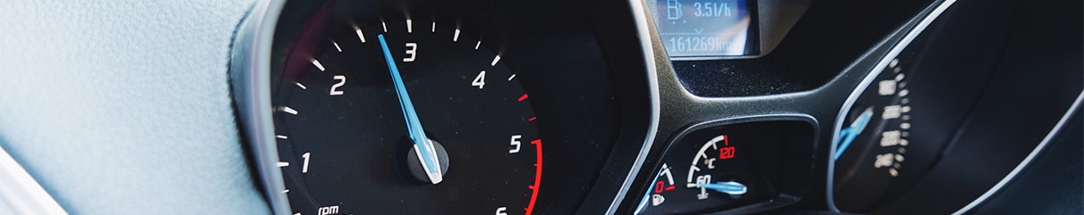 Learn Maintenance Warning Signs at West Broad Kia in Henrico, VA | Close up of car dashboard speedometer with blue indicator 