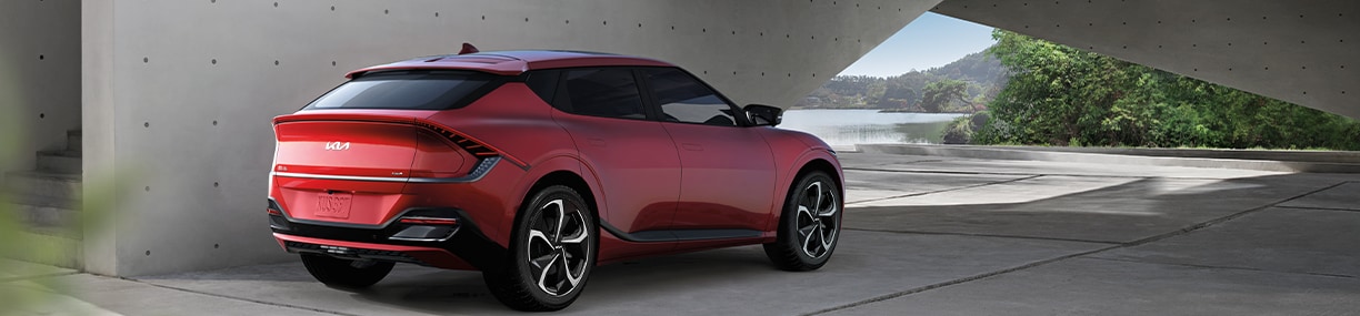 How to prepare your home for your new Electric Vehicle at West Broad Kia in Henrico, VA | Rear view of a Red 2023 Kia EV6 parked outside 