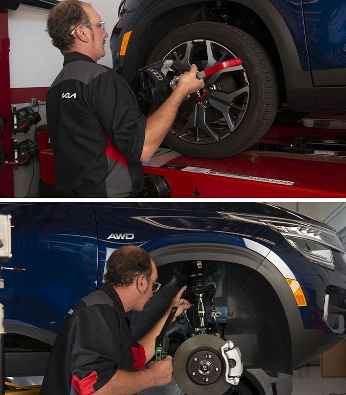 Best MPG At   West Broad Kia in Henrico, VA | Mechanic in black Kia uniform is doing an alignment on car wheels / Mechanic in black Kia uniform is inspecting car shocks of a blue Kia 
