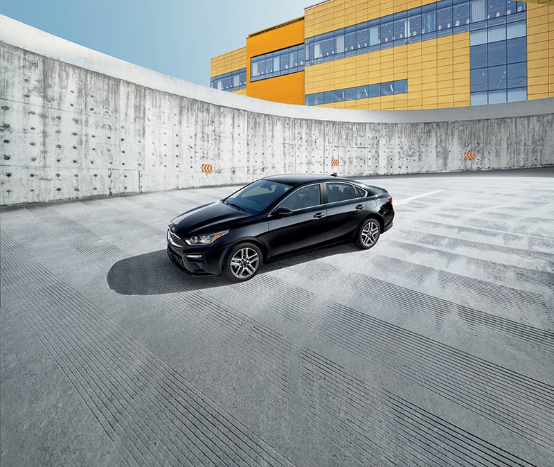 West Broad Kia is a Kia Dealership in Richmond near Ashland, VA | 2020 Kia Forte parked on a rooftop