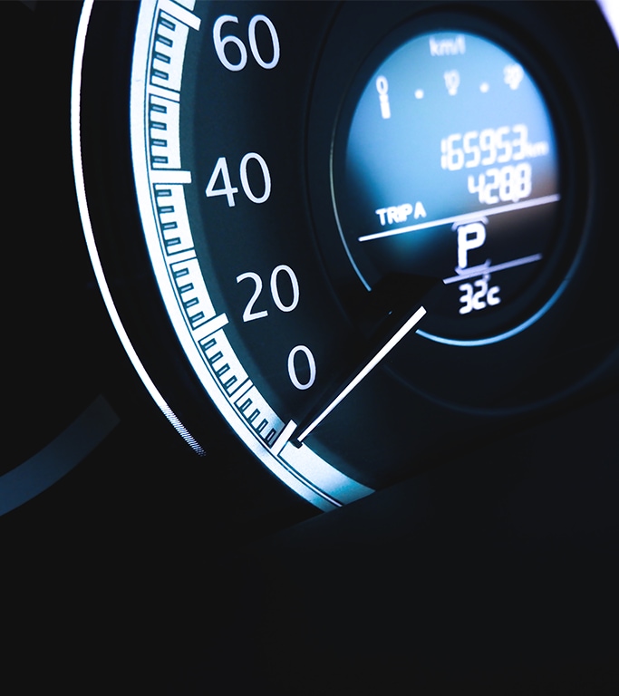 When to Trade In Your Car | West Broad Kia in Henrico, VA | Close up of car dashboard showcasing car mileage and trip