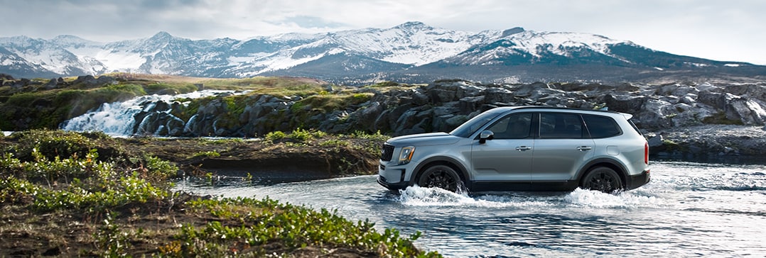 Compare the 2021 Kia Telluride vs. the 2021 Honda Pilot at West Broad Kia | Telluride going threw river