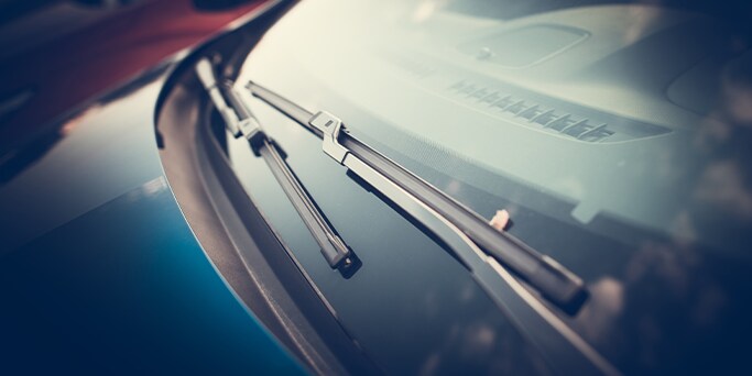 How to Get Your Car Summer Ready at West Broad Kia in Henrico, VA | Front Windshield wipers turned off on a blue vehicle  
