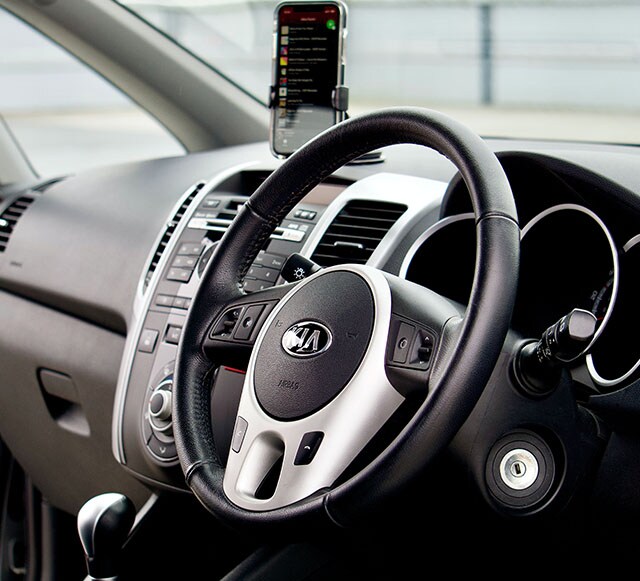 Accessories that help keep your Kia protected at West Broad Kia in Richmond, VA | Kia Car Interior with a Focus on the Steering Wheel