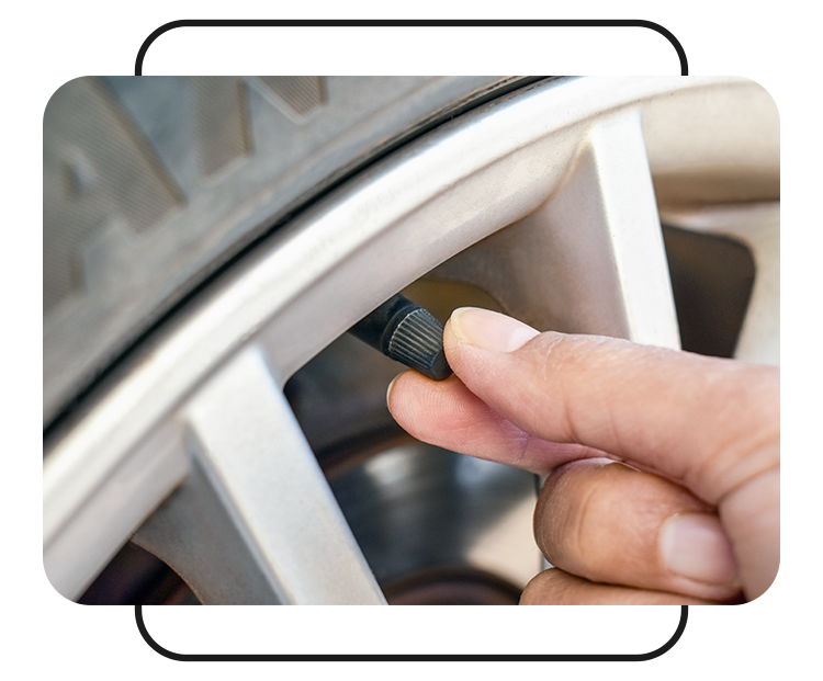Tire Pressure Information at West Broad Kia in Henrico, VA | Close up of a person removing the cap to the tire pressure valve 
