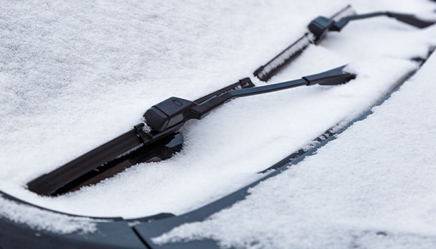 How to prepare your Kia for the winter season in Henrico, VA at West Broad Kia | Snow cover front car windshield and wiper blades
