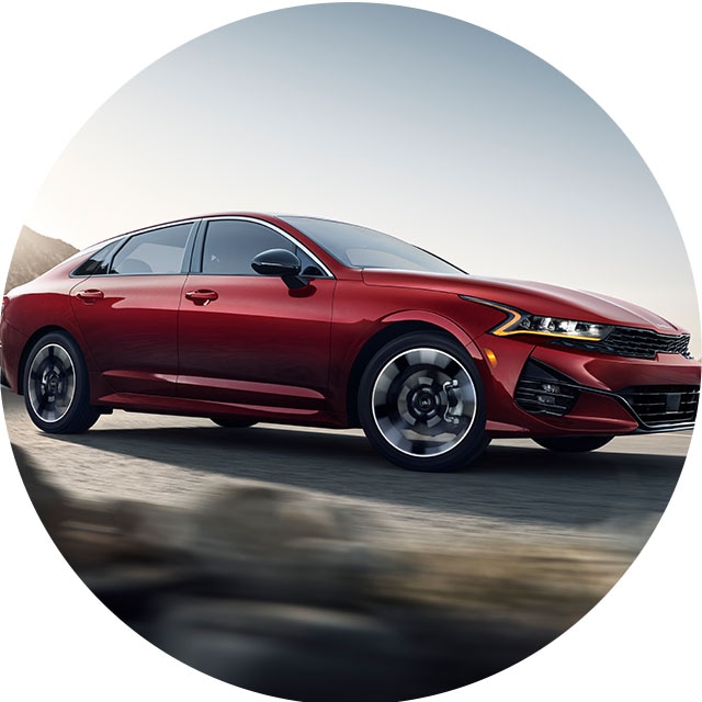 How to Jump Start a Car |  West Broad Kia in Richmond, VA | Red Kia K5 Driving on Mountain Road