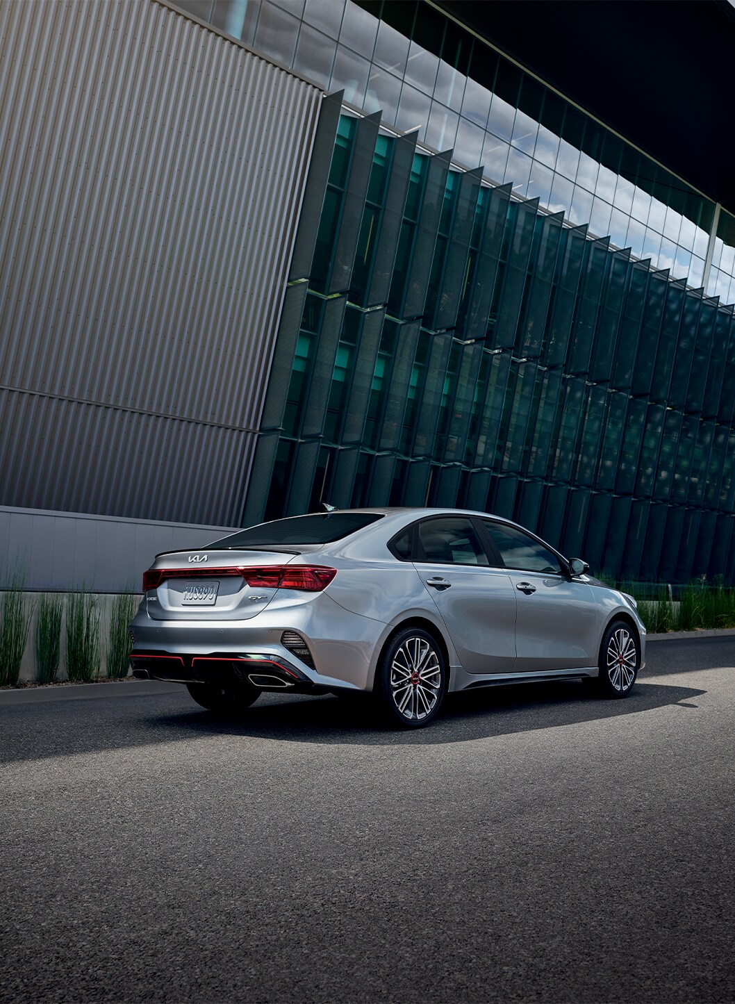 2023 Kia Forte at West Broad Kia in Henrico, VA | Rear view of a parked silver 2023 Kia Forte 