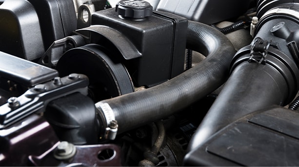 How to prepare your Kia for the winter season in Henrico, VA at West Broad Kia | close up of radiator hose located in the engine bay 