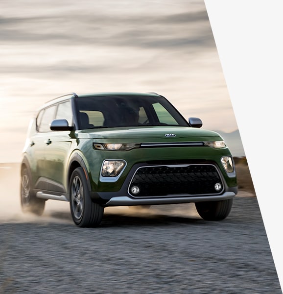 West Broad Kia is a Kia Dealership in Richmond near Bon Air, VA | Green Kia Soul Driving Through Desert