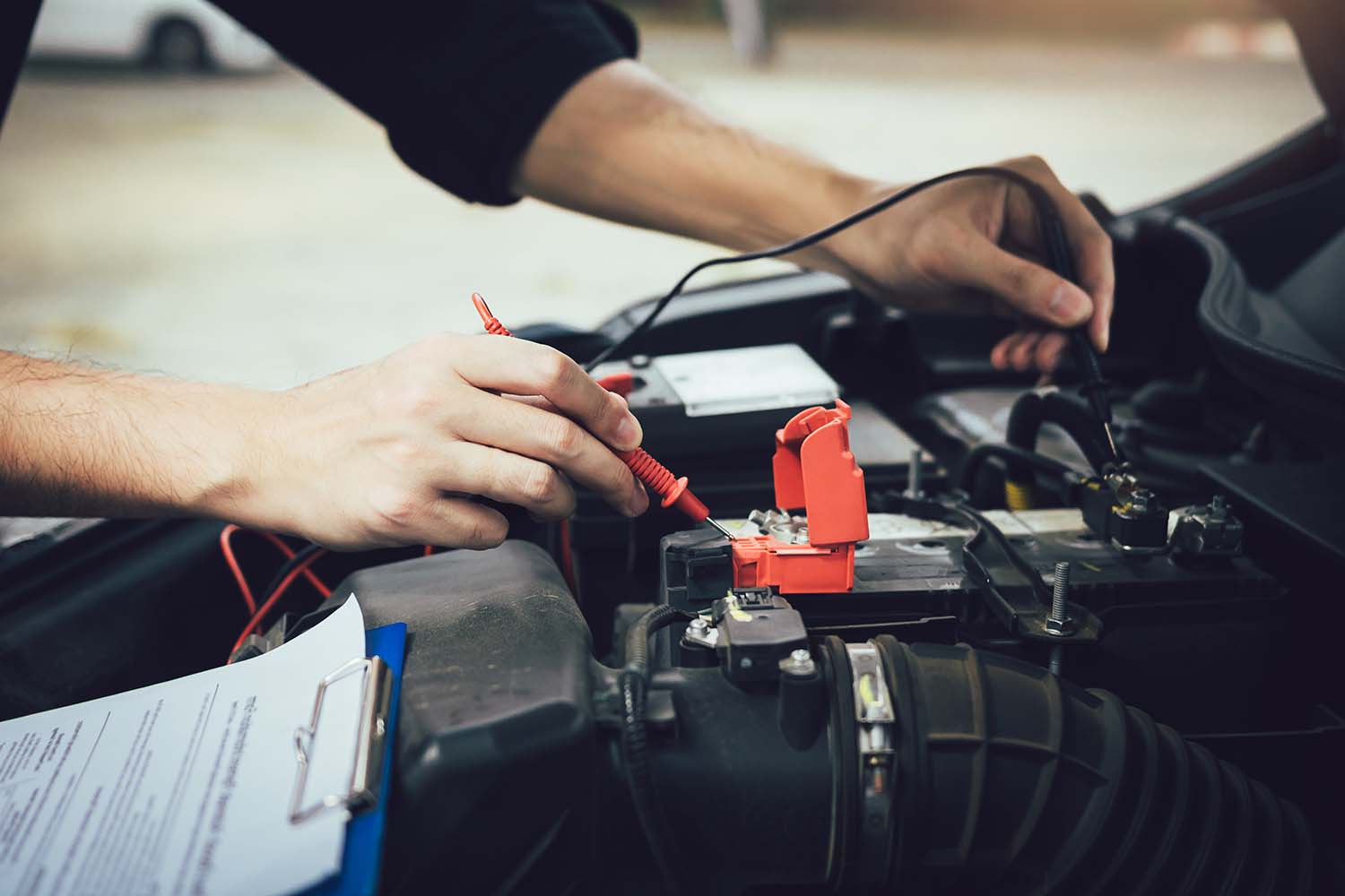 Everything You Need to Know about Your Car Battery at West Broad Volkswagen | Volkswagen service technician testing the life of a battery in a vehicle