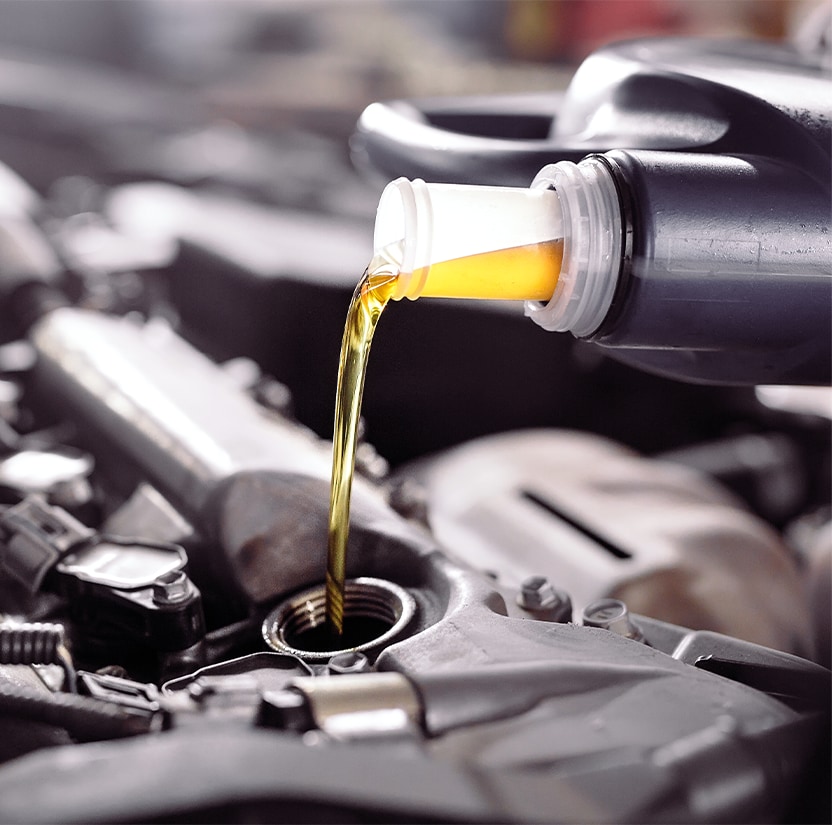 Extend the Life of Your Vehicle at West Broad VW in Richmond, VA | Yellow Synthetic oil being poured into engine  