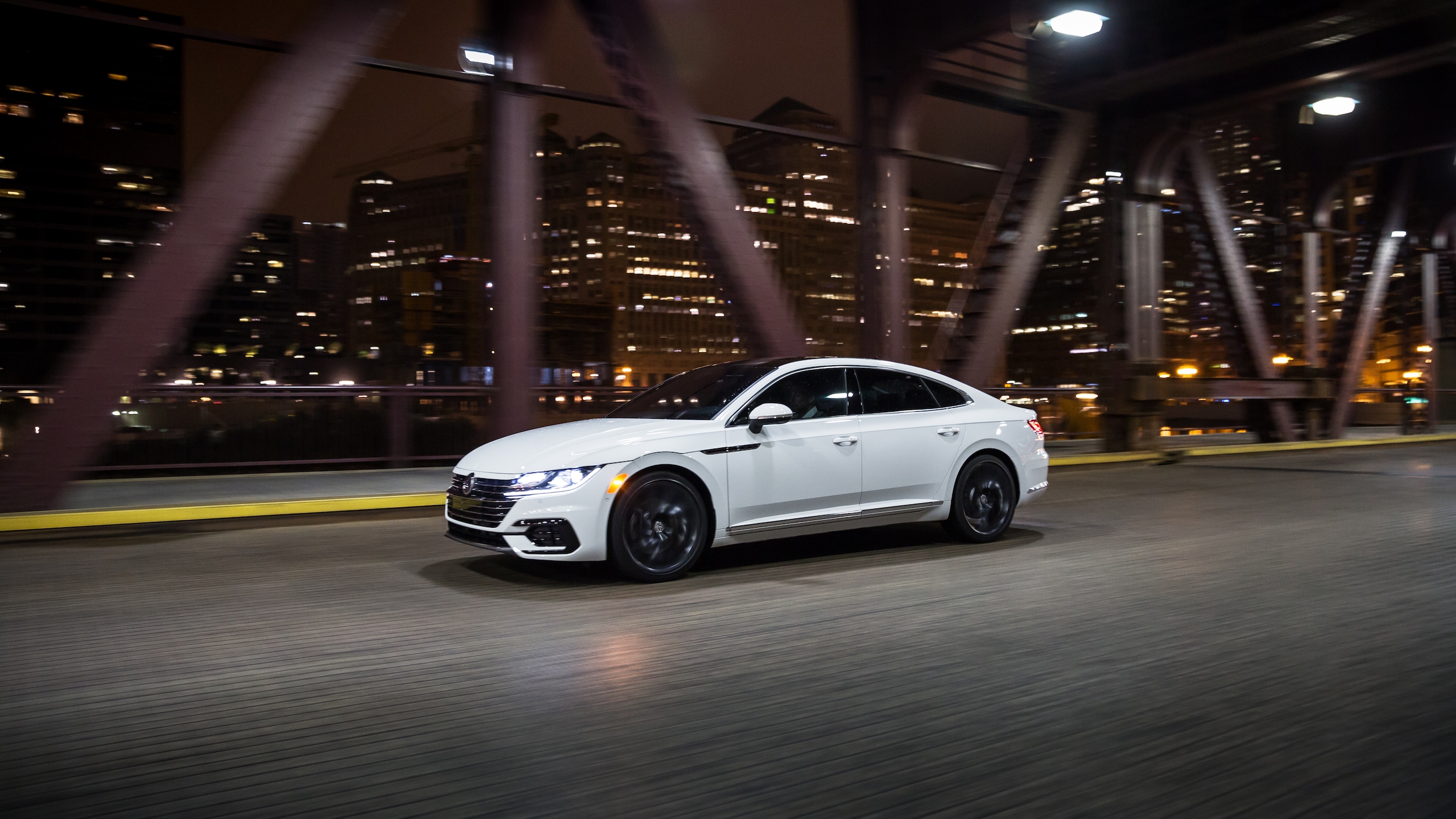 West Broad Volkswagen is a Volkswagen Dealership near Innsbrook, VA | 2021 Volkswagen Arteon driving on bridge