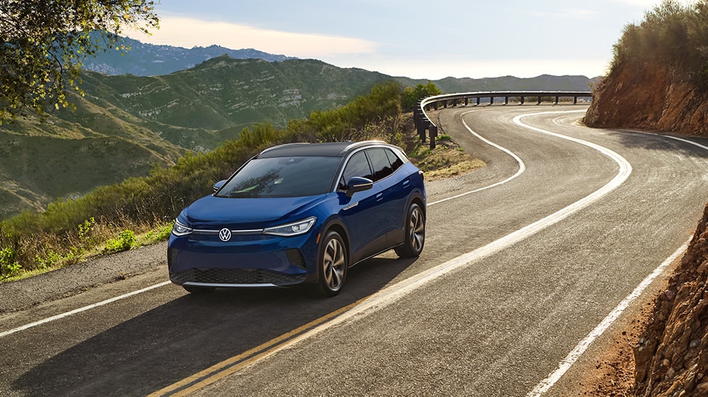 How to prepare your home for your new Electric Vehicle at West Broad Volkswagen in Richmond | 2021 Volkswagen ID.4 EV driving on mountain road