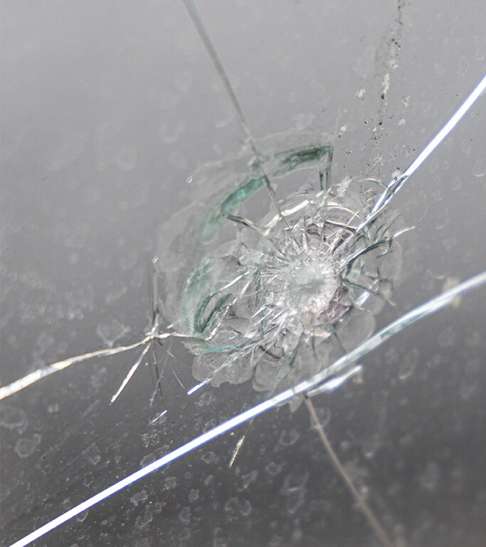Why You Shouldn’t Drive Around with a Chipped Windshield at West Broad VW in Richmond, VA | Cracked windshield on grey background